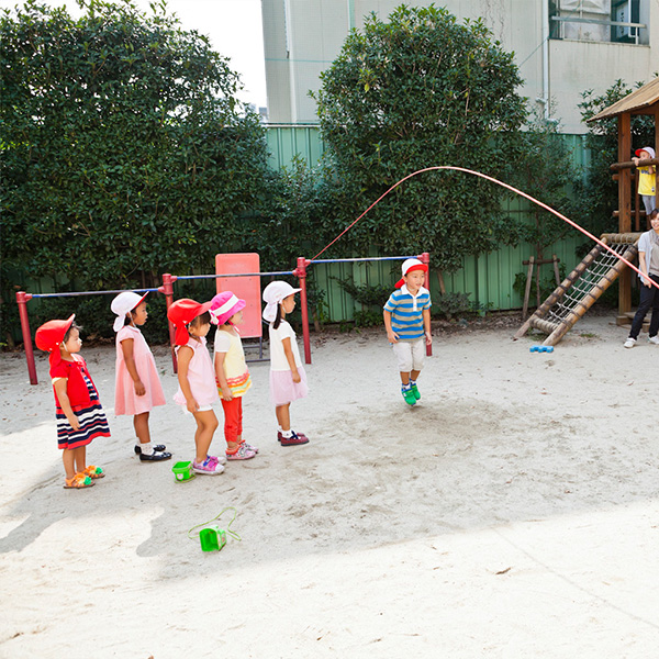 Children engage actively in outdoor physical activities through exercises and play.